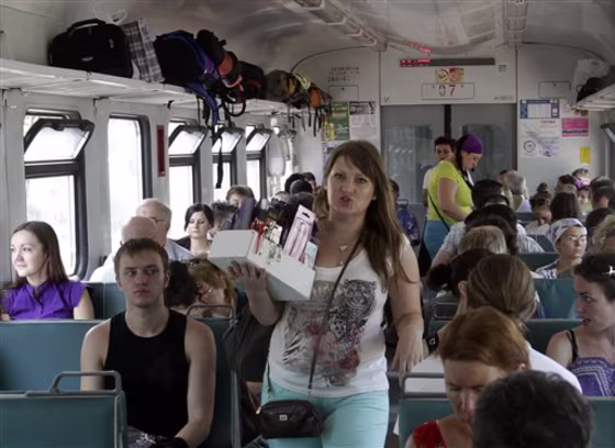 A&nbsp;vendor advertises her goods on a short-distance electric train, or elektrichka, in Moscow's outskirts. 